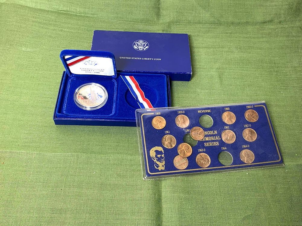 One 1986 Liberty Dollar Silver Coin and Lincoln Memorial Series Pennies. In-house shipping 