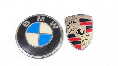 Two Vintage Automotive Emblems: A BMW Rear Trunk Emblem and a Porsche Crest. A pair of vintage 