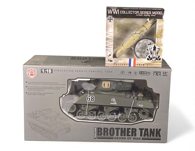 Two Boxed Military-Themed Collector's Models: A WWI Zeppelin Model and a Remote Control Tank. A 