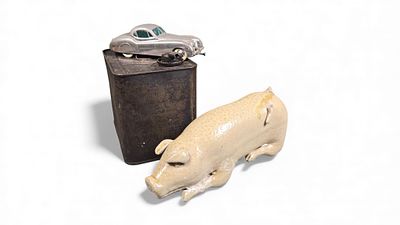 A Group of Three Items: A Glazed Stoneware Pig Flask, a FRAMETA Kolner Automodelle Die-Cast 