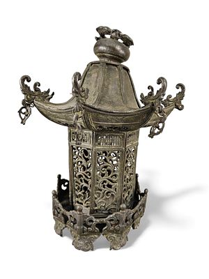A Japanese Bronze Pagoda Lantern. A Japanese bronze pagoda lantern, featuring a multi-tiered 