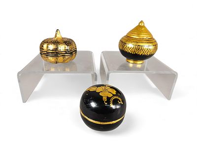 A Group of Three Mid-20th Century Thai Black and Gold Lacquer Lidded Boxes. A group of three 