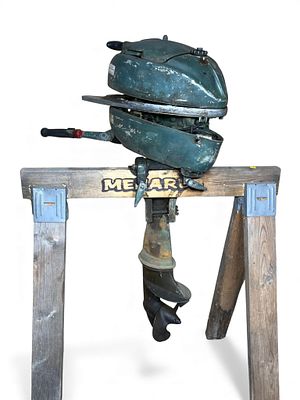 A Vintage Johnson Teal-Green Outboard Motor, circa 1963. A vintage Johnson outboard motor.. The 