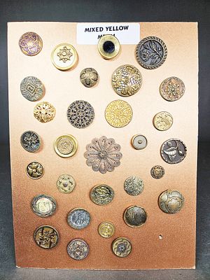 A Collection of Antique and Vintage Yellow Metal Fashion Buttons. This lot features a collection 