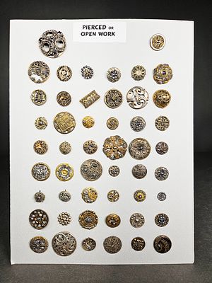 A Collection of Victorian Pierced Metal Buttons. This collection features multiple antique and 