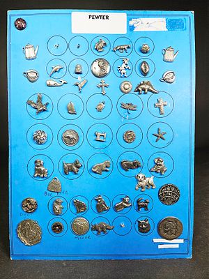 A Collection of Pewter Buttons with Animal and Everyday Motifs. A collection of pewter buttons 