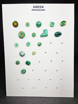 An Assortment of Vintage Green Moonglow Buttons. An assortment of vintage buttons rendered in 