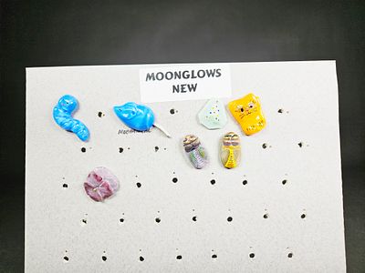 A Collection of Vintage Moonglow Glass Novelty Buttons. This collection of vintage novelty 