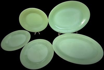 A Set of Fire-King Jadeite Jane Ray Pattern Plates and Platters. A set of vintage Jadeite 
