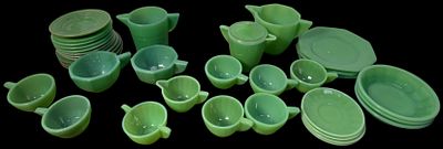 An Assortment of Vintage Jadeite Children's Toy Tea Set Pieces in the Style of Akro Agate and 