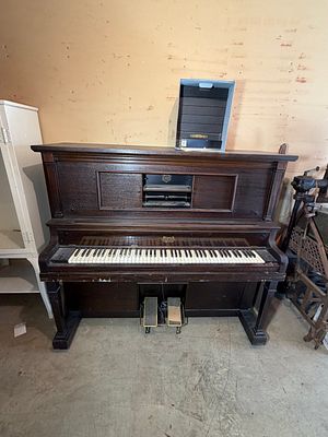 P.A. Starck Upright Player Piano with Music Roll Collection. This dark-finished upright player 