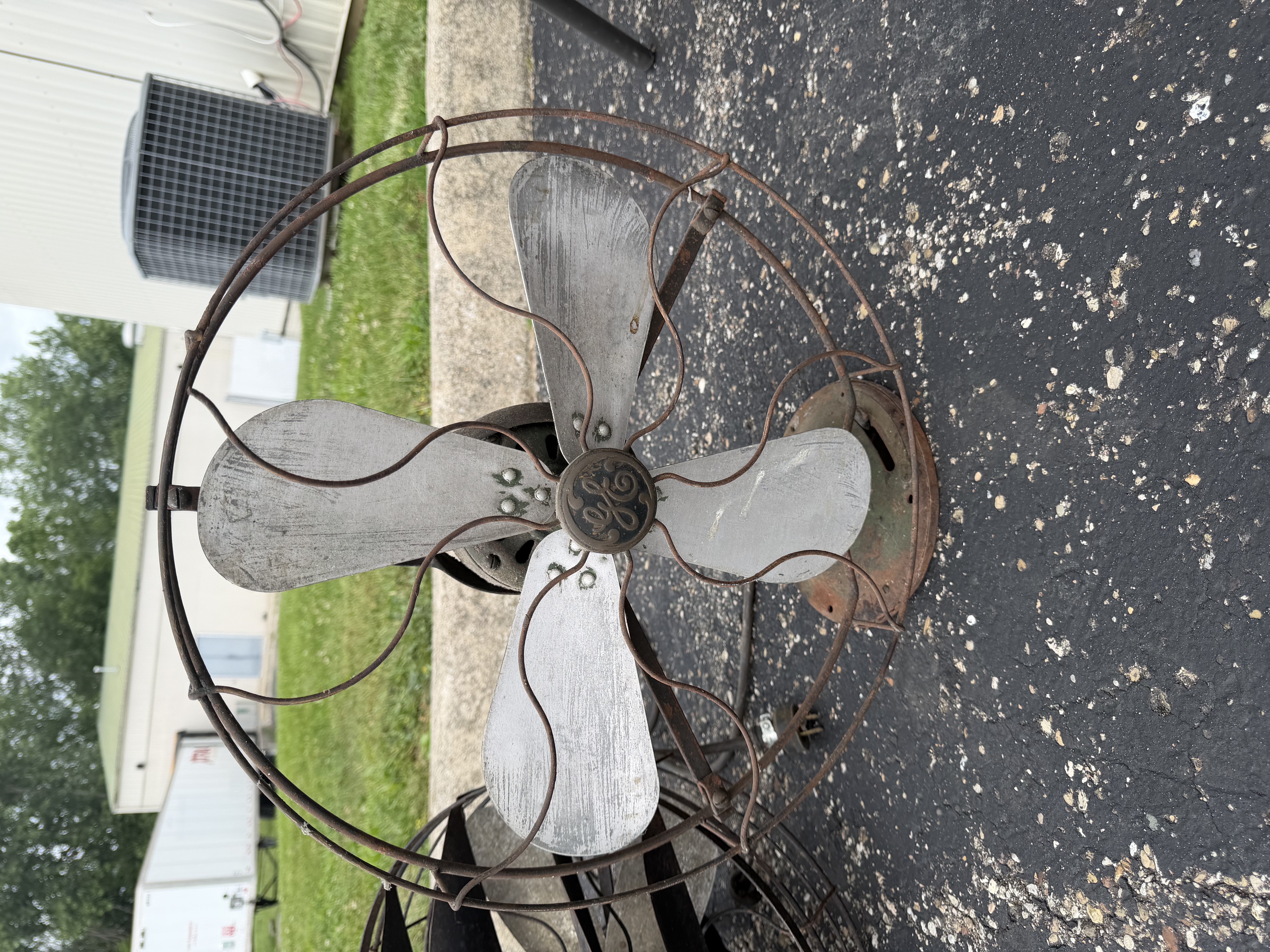 An Assortment of Vintage Electric Desk Fans and Spare Fan Cage
