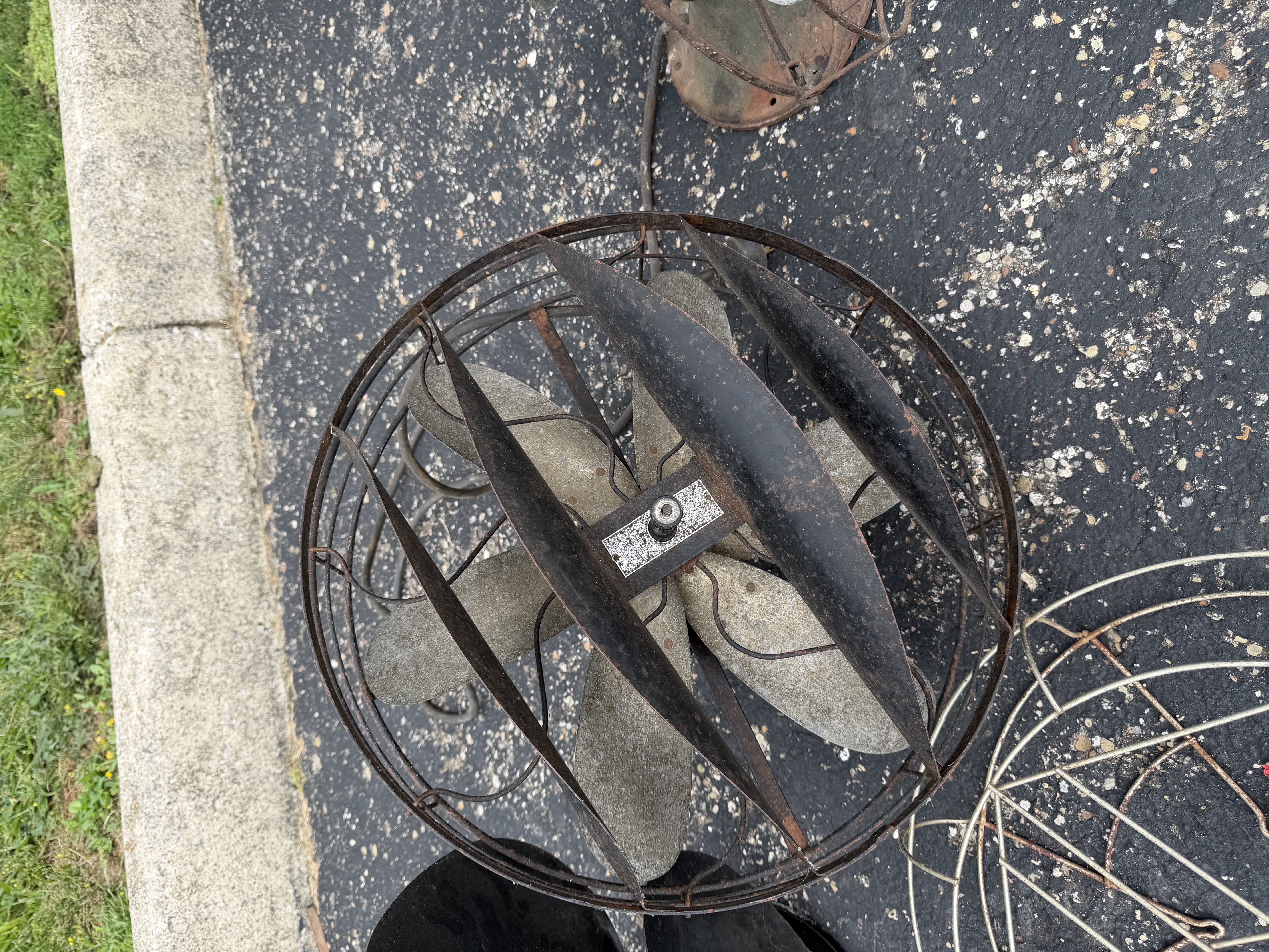 An Assortment of Vintage Electric Desk Fans and Spare Fan Cage