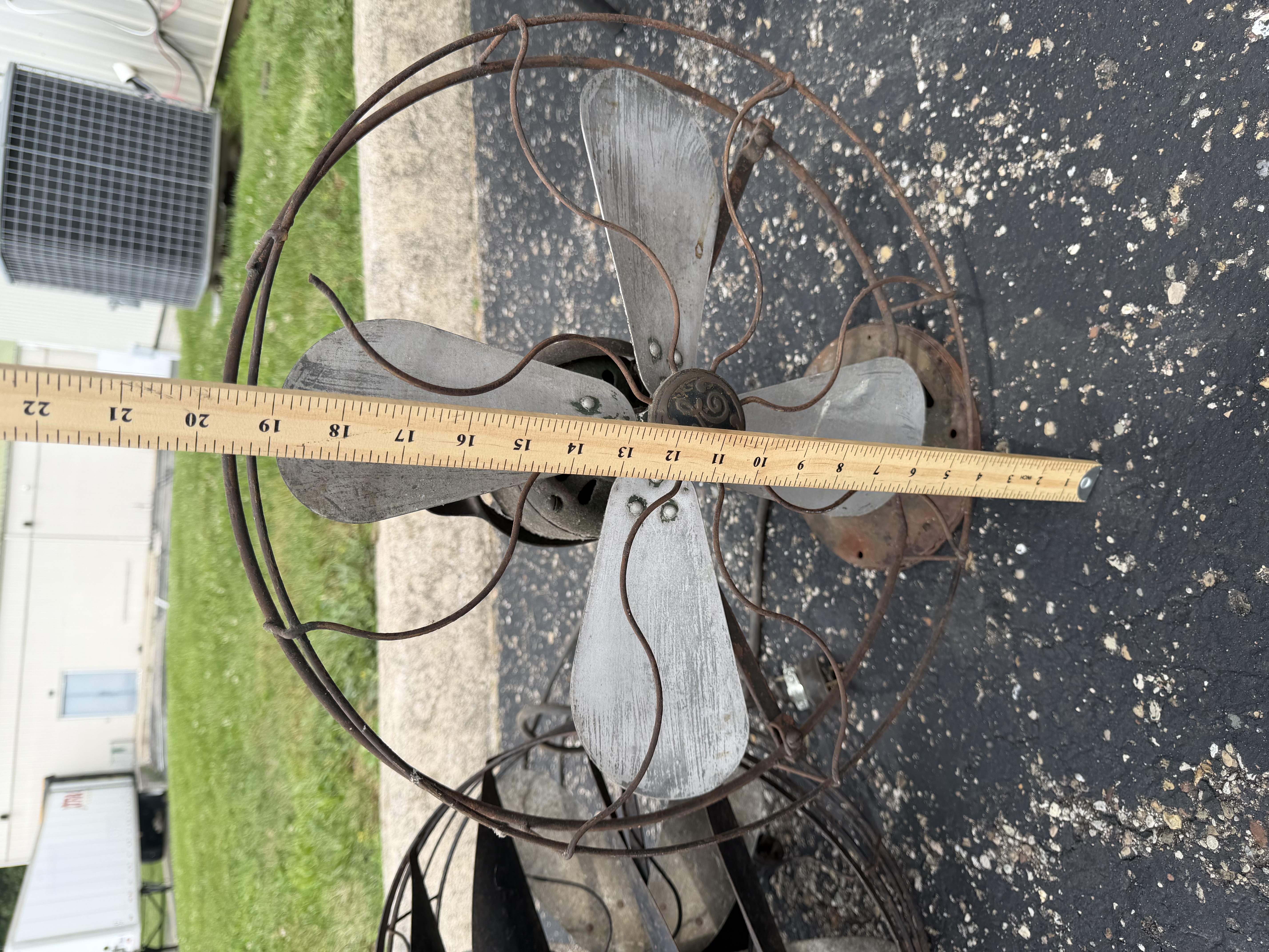 An Assortment of Vintage Electric Desk Fans and Spare Fan Cage