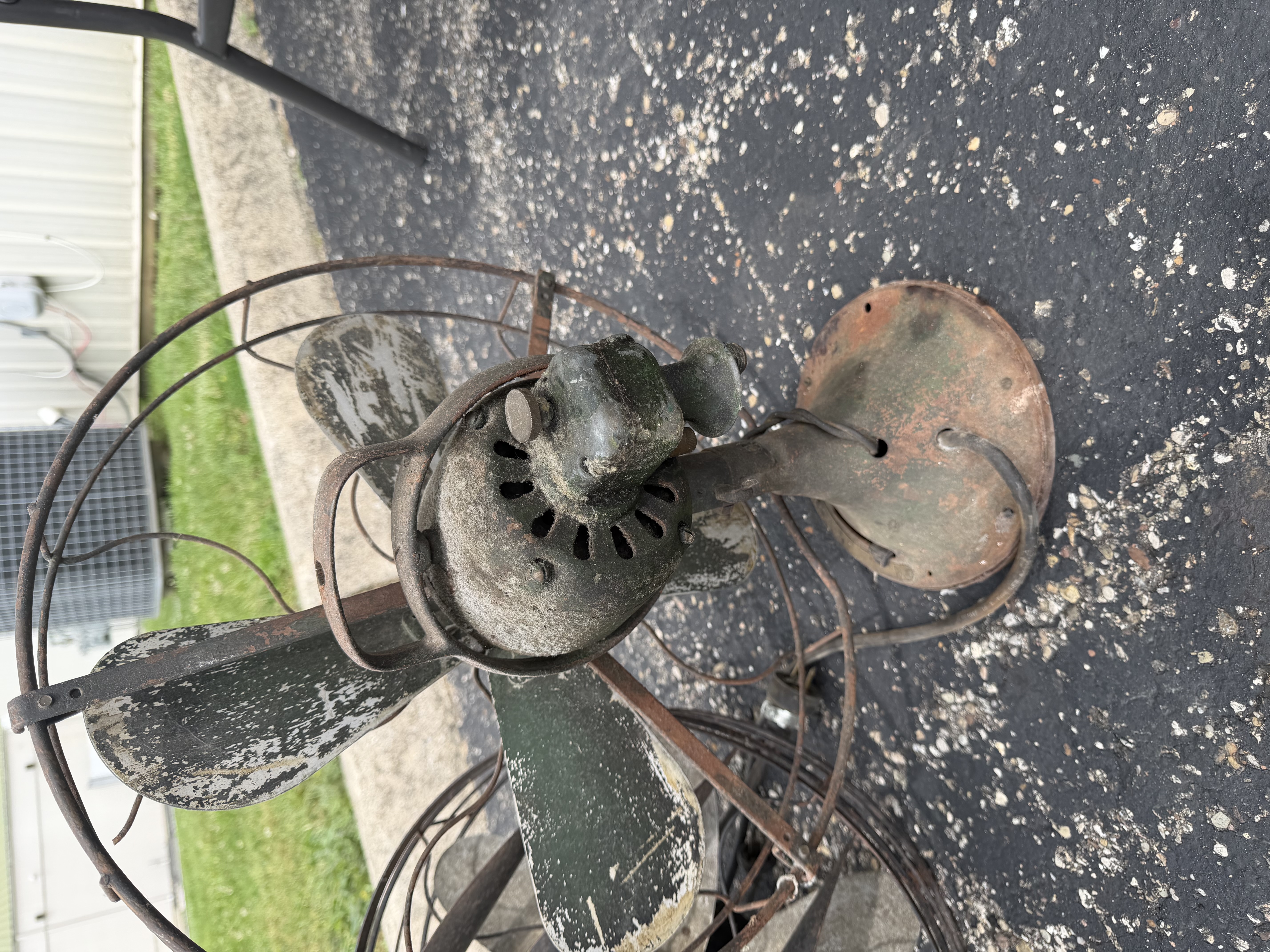 An Assortment of Vintage Electric Desk Fans and Spare Fan Cage