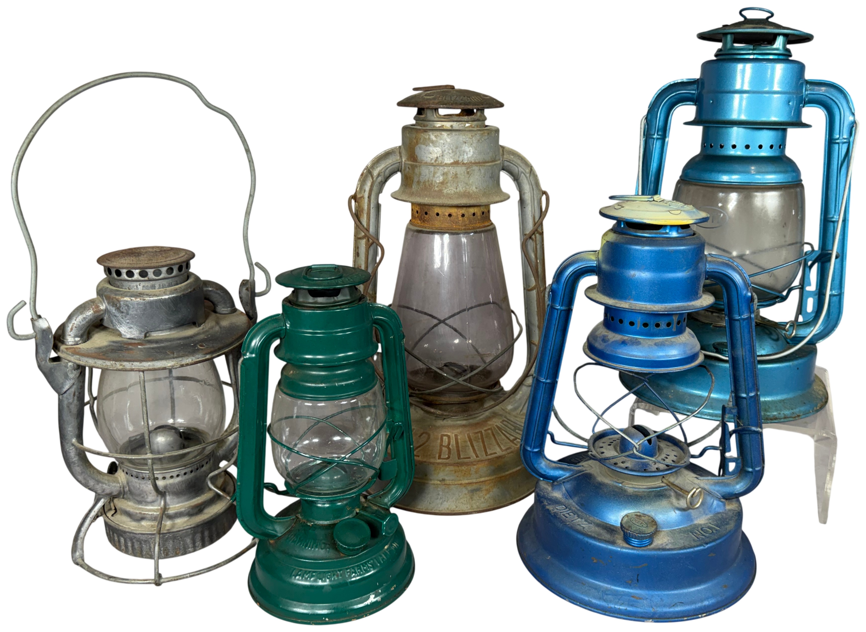 A Collection of Vintage and Contemporary Metal Oil Lanterns Including Dietz and Lamplight Farms