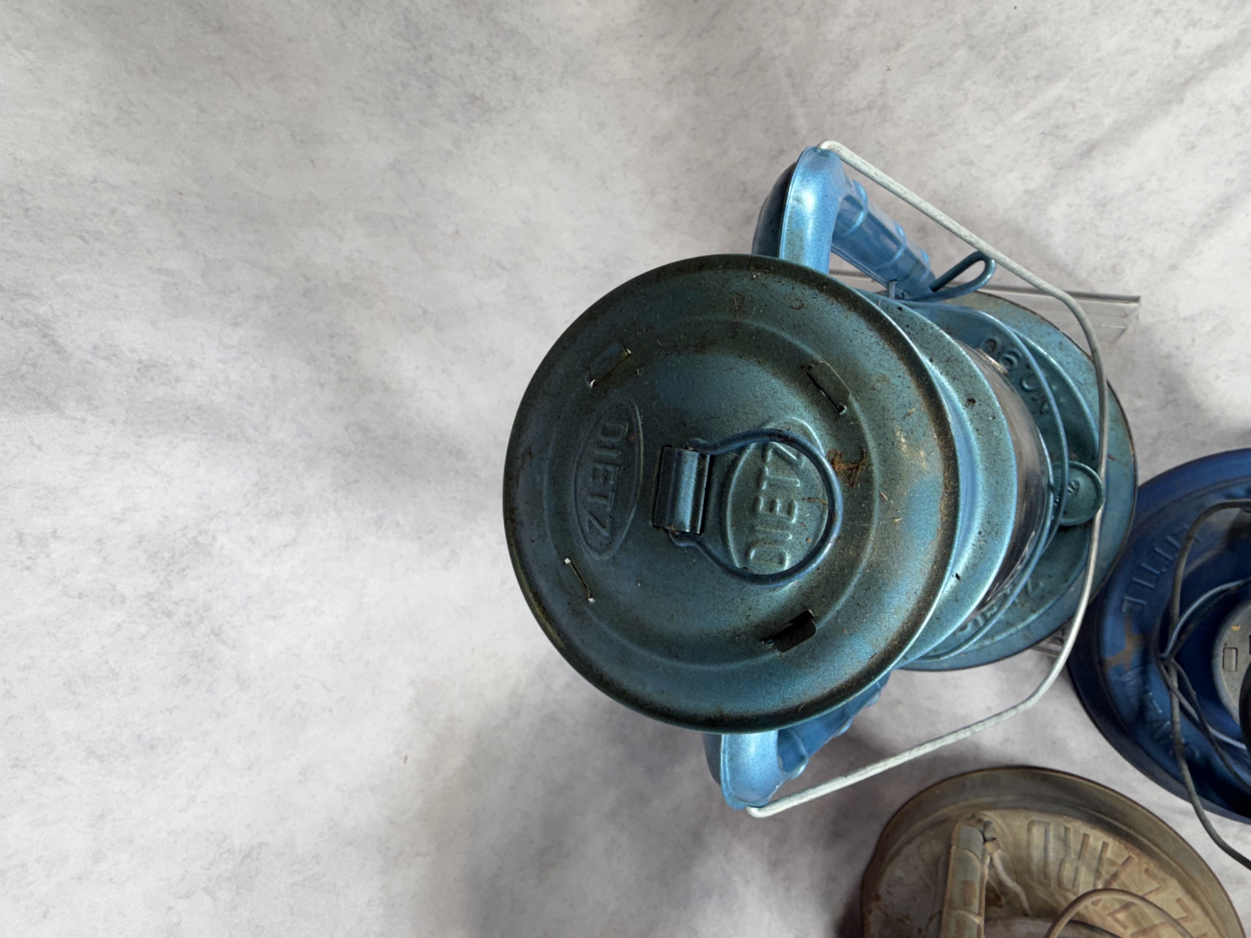 A Collection of Vintage and Contemporary Metal Oil Lanterns Including Dietz and Lamplight Farms
