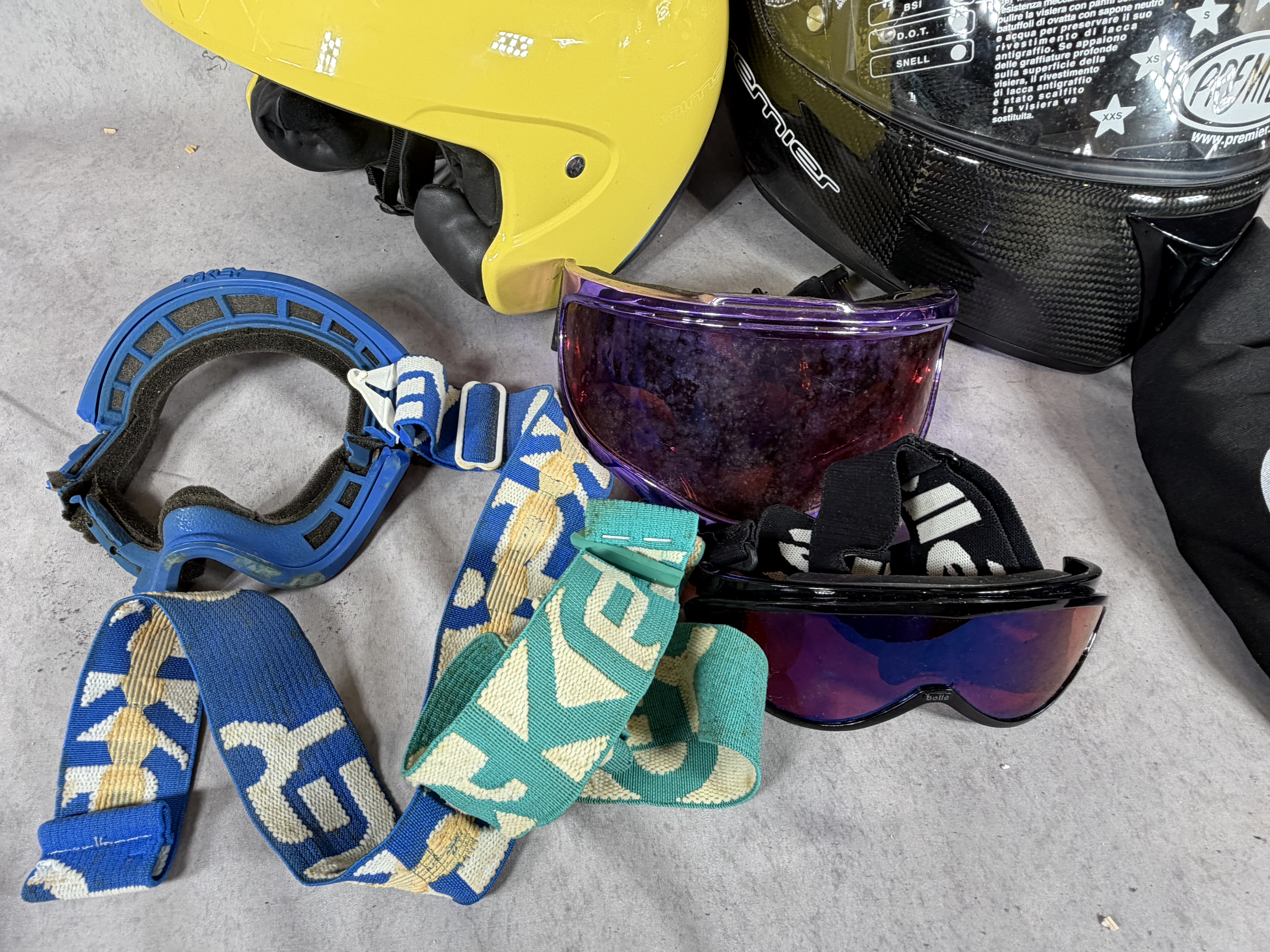 An Assortment of Sporting and Motorcycle Safety Gear Including BMW and Premier Helmets and Goggles