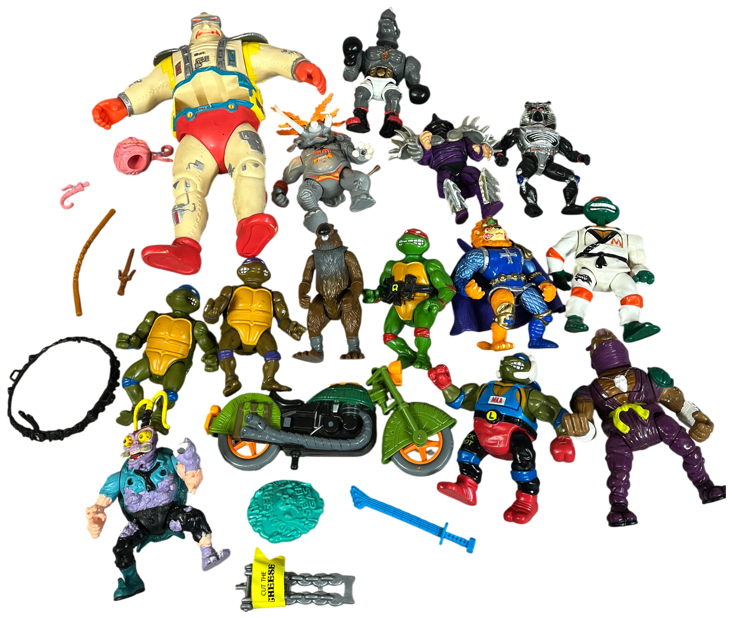 A Collection of Vintage Playmates Teenage Mutant Ninja Turtles Action Figures and Accessories