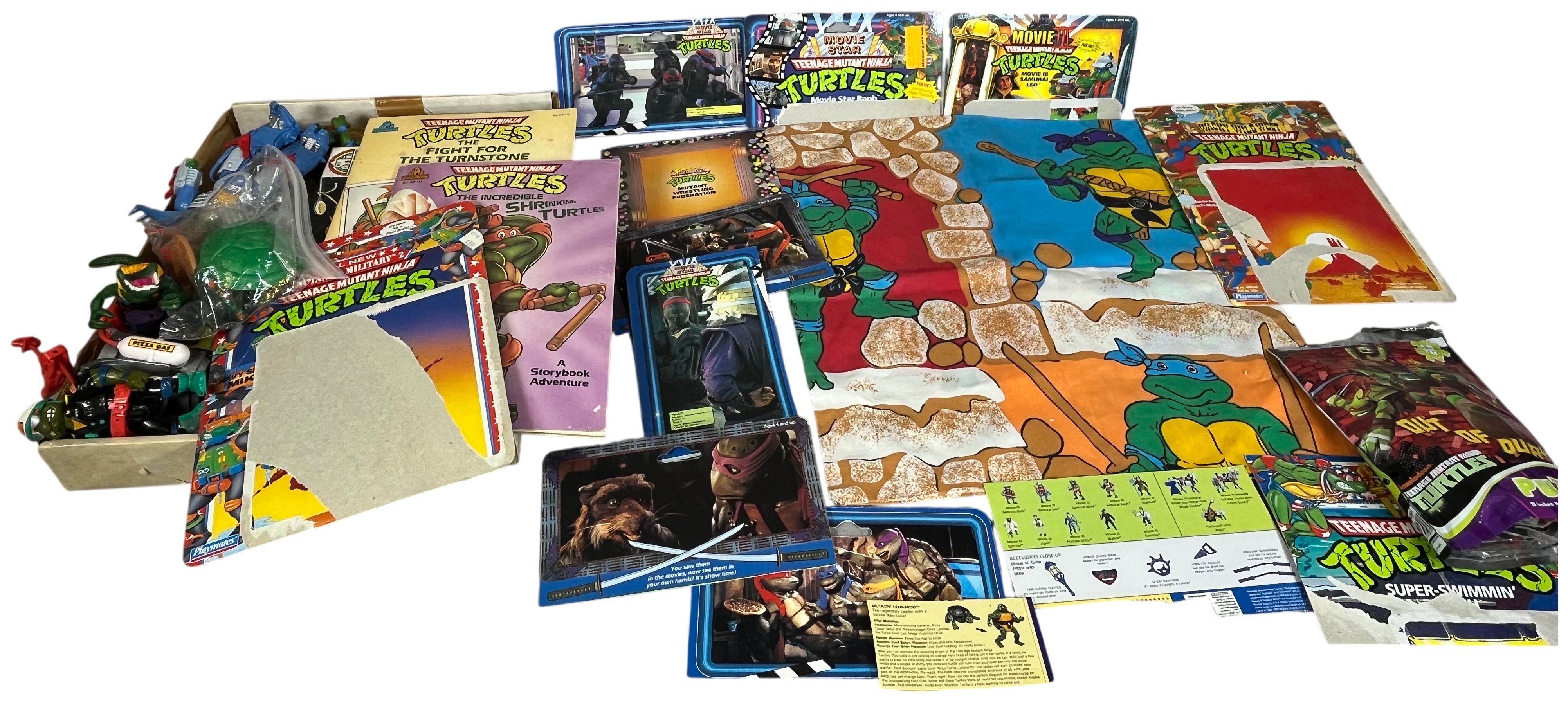 A Collection of Vintage Teenage Mutant Ninja Turtles Action Figures and Memorabilia by Playmates and Random House