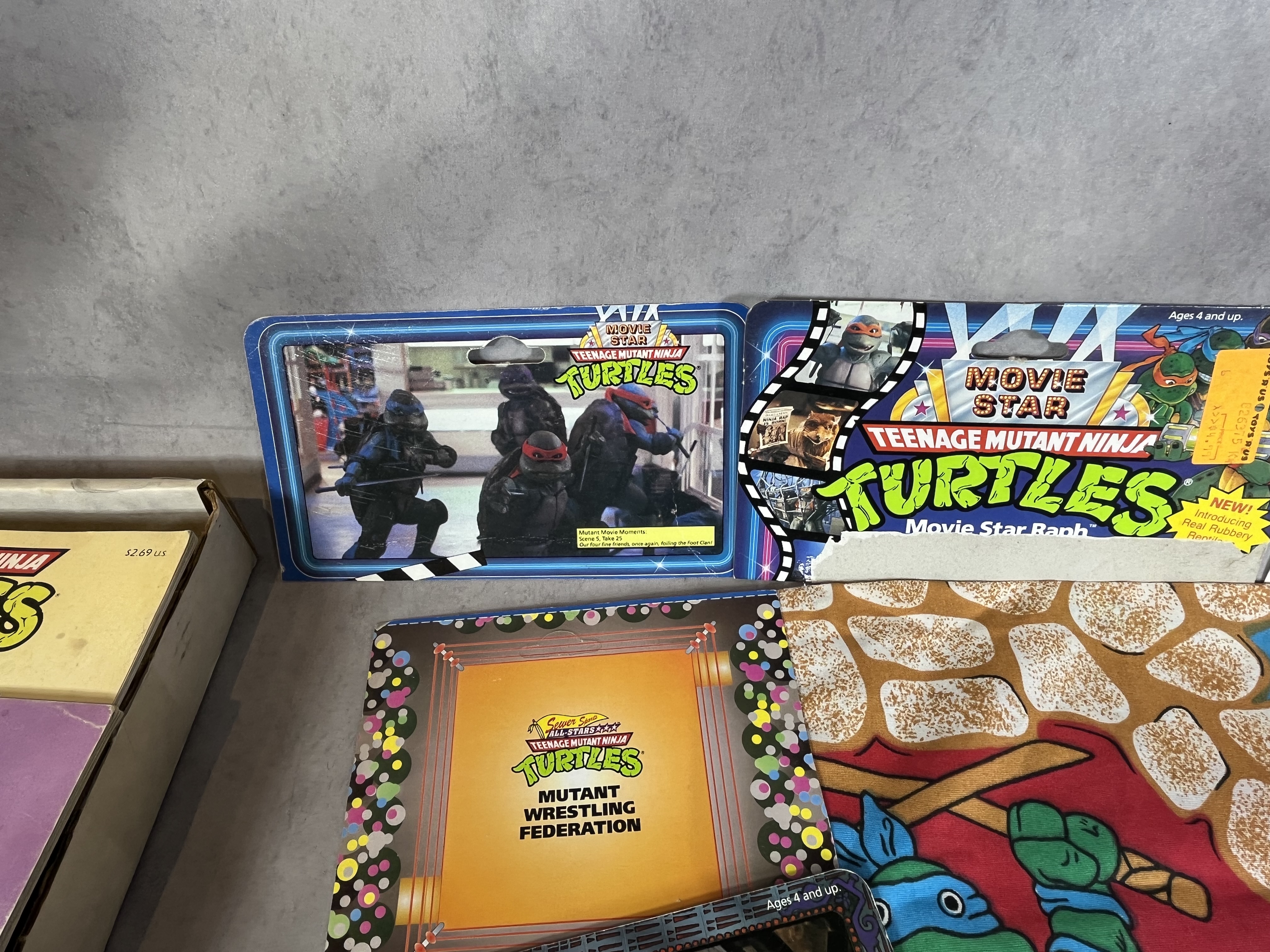 A Collection of Vintage Teenage Mutant Ninja Turtles Action Figures and Memorabilia by Playmates and Random House