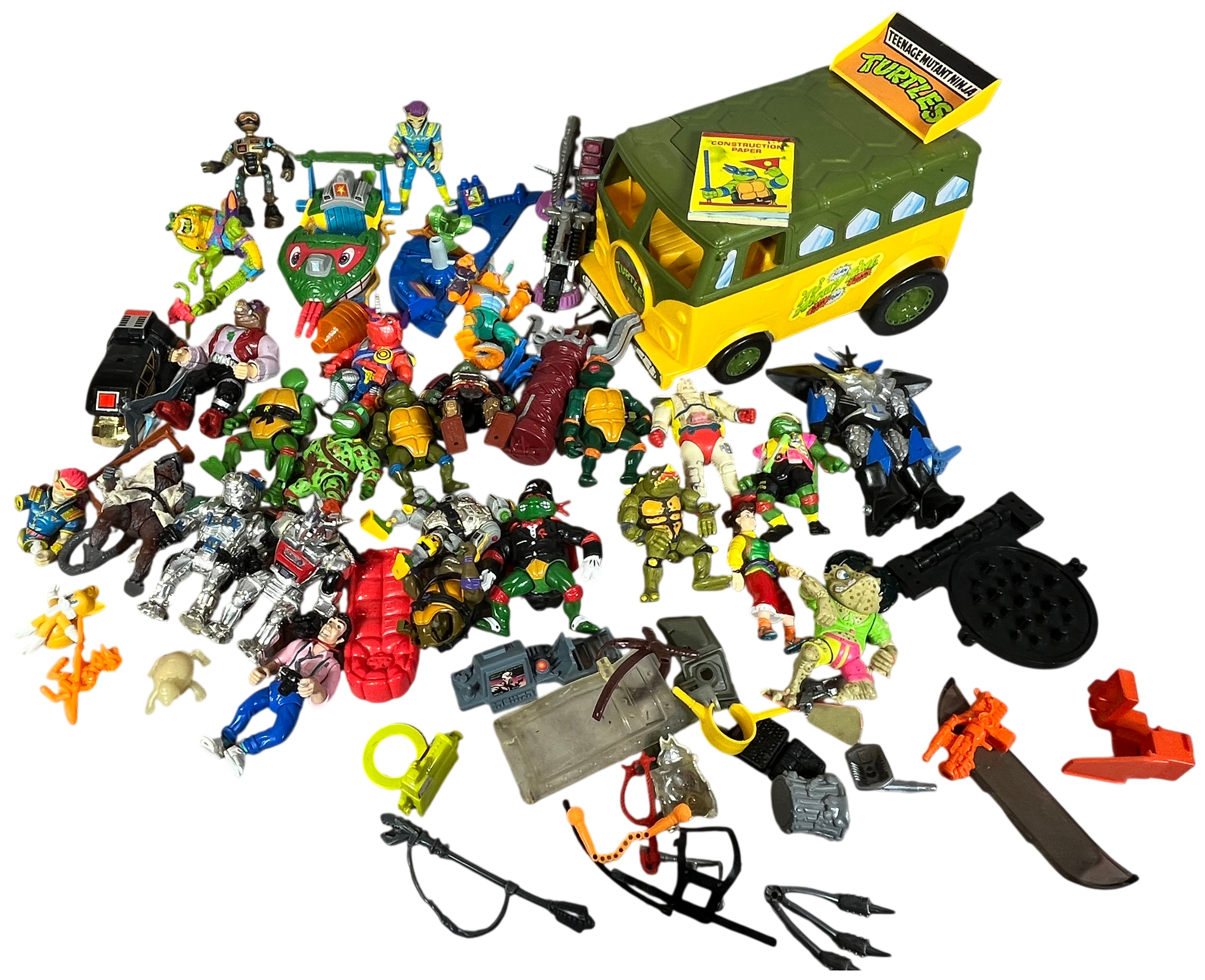 A Collection of Vintage Playmates Teenage Mutant Ninja Turtles Action Figures and Vehicles