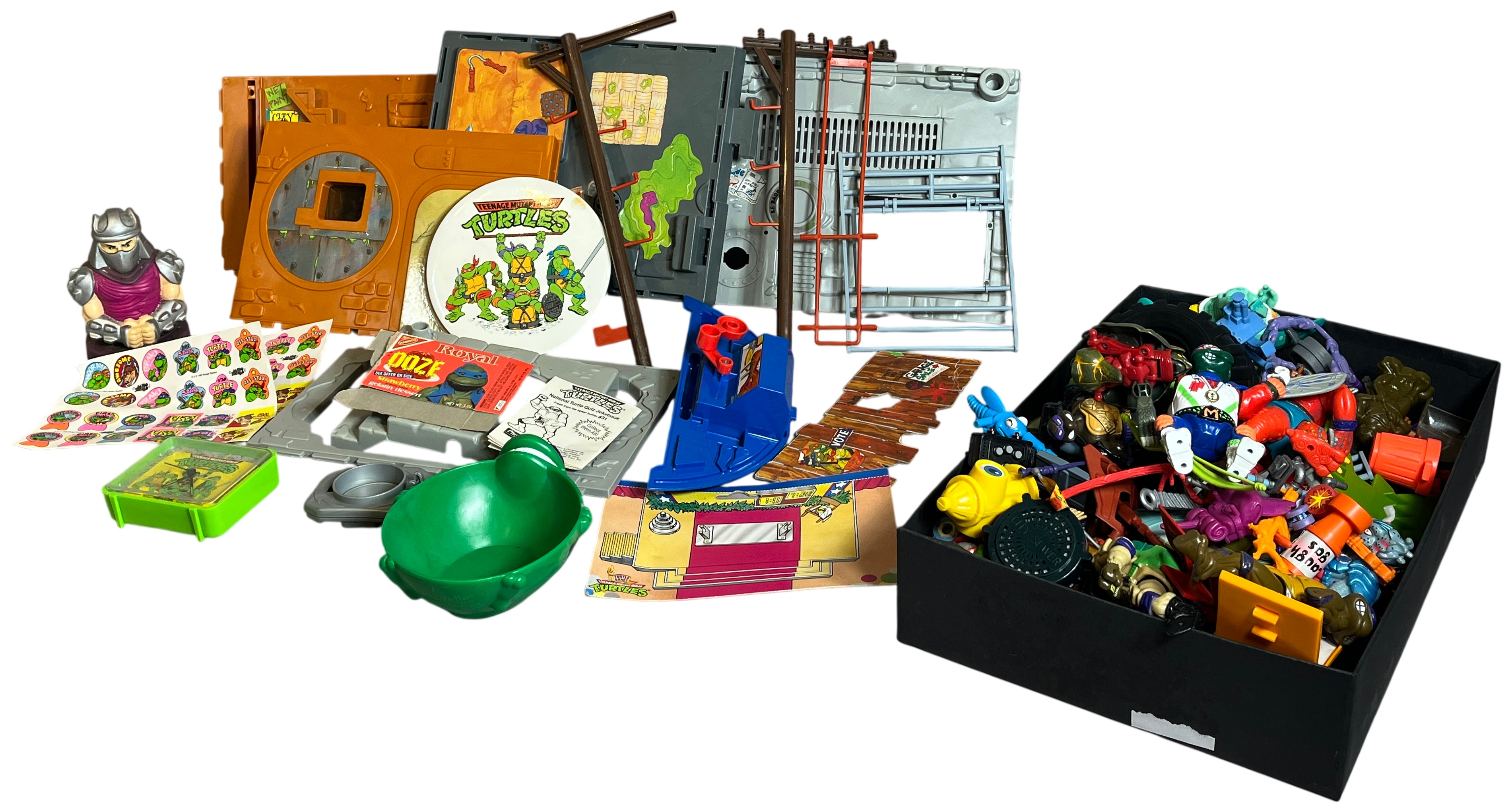 Assortment of Vintage Teenage Mutant Ninja Turtles Action Figures and Sewer Playset Components by Playmates Toys