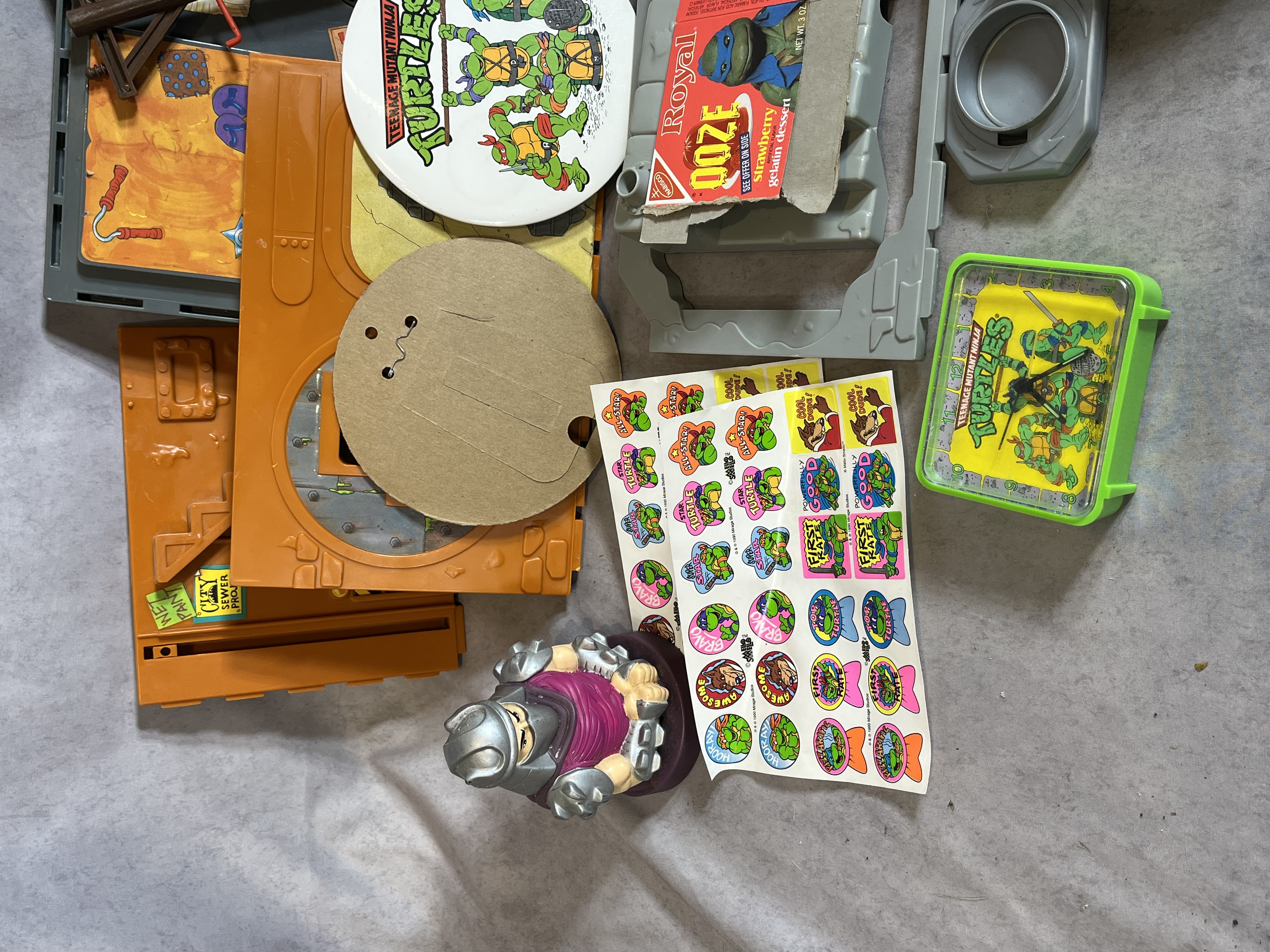 Assortment of Vintage Teenage Mutant Ninja Turtles Action Figures and Sewer Playset Components by Playmates Toys