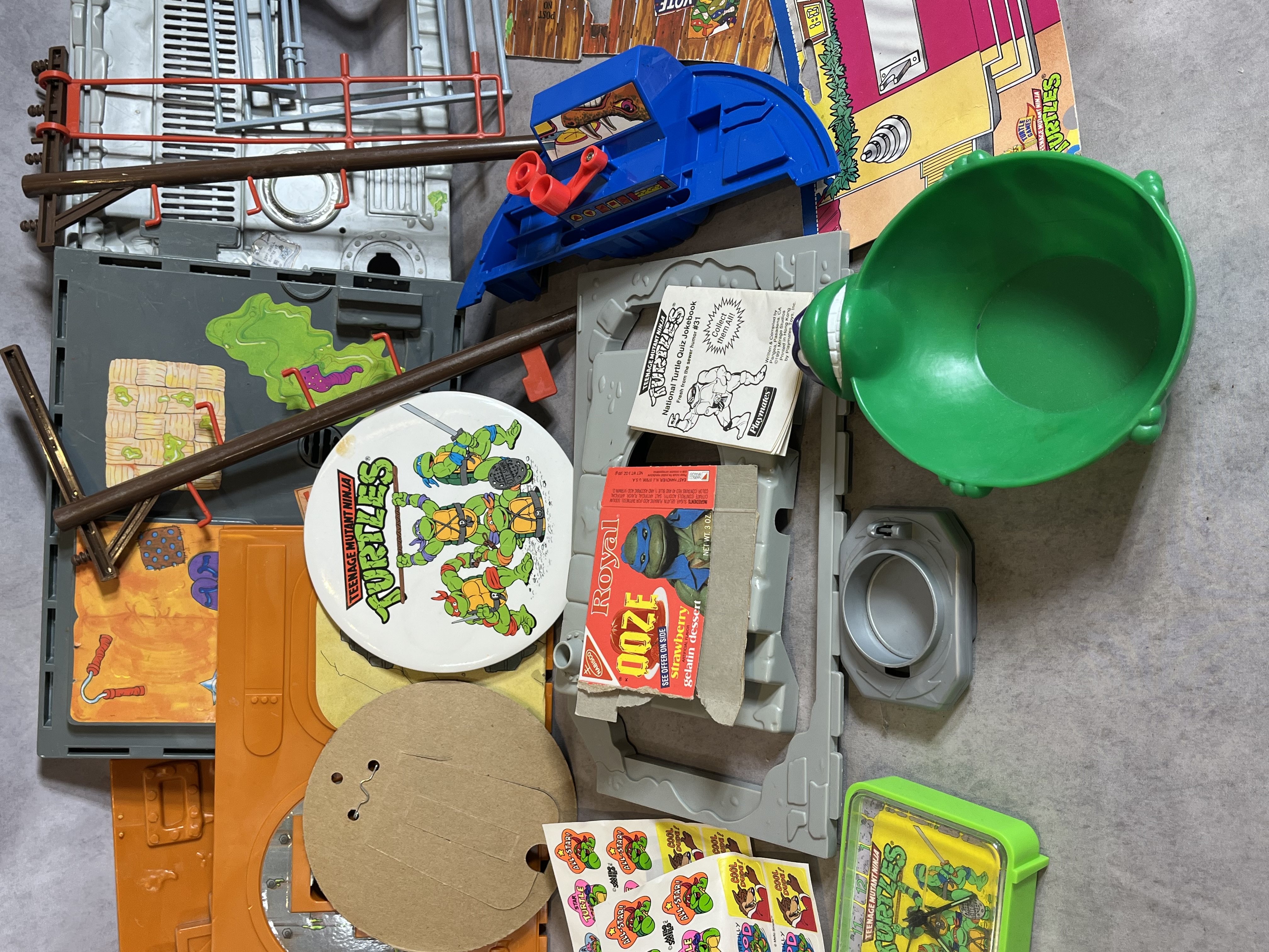 Assortment of Vintage Teenage Mutant Ninja Turtles Action Figures and Sewer Playset Components by Playmates Toys