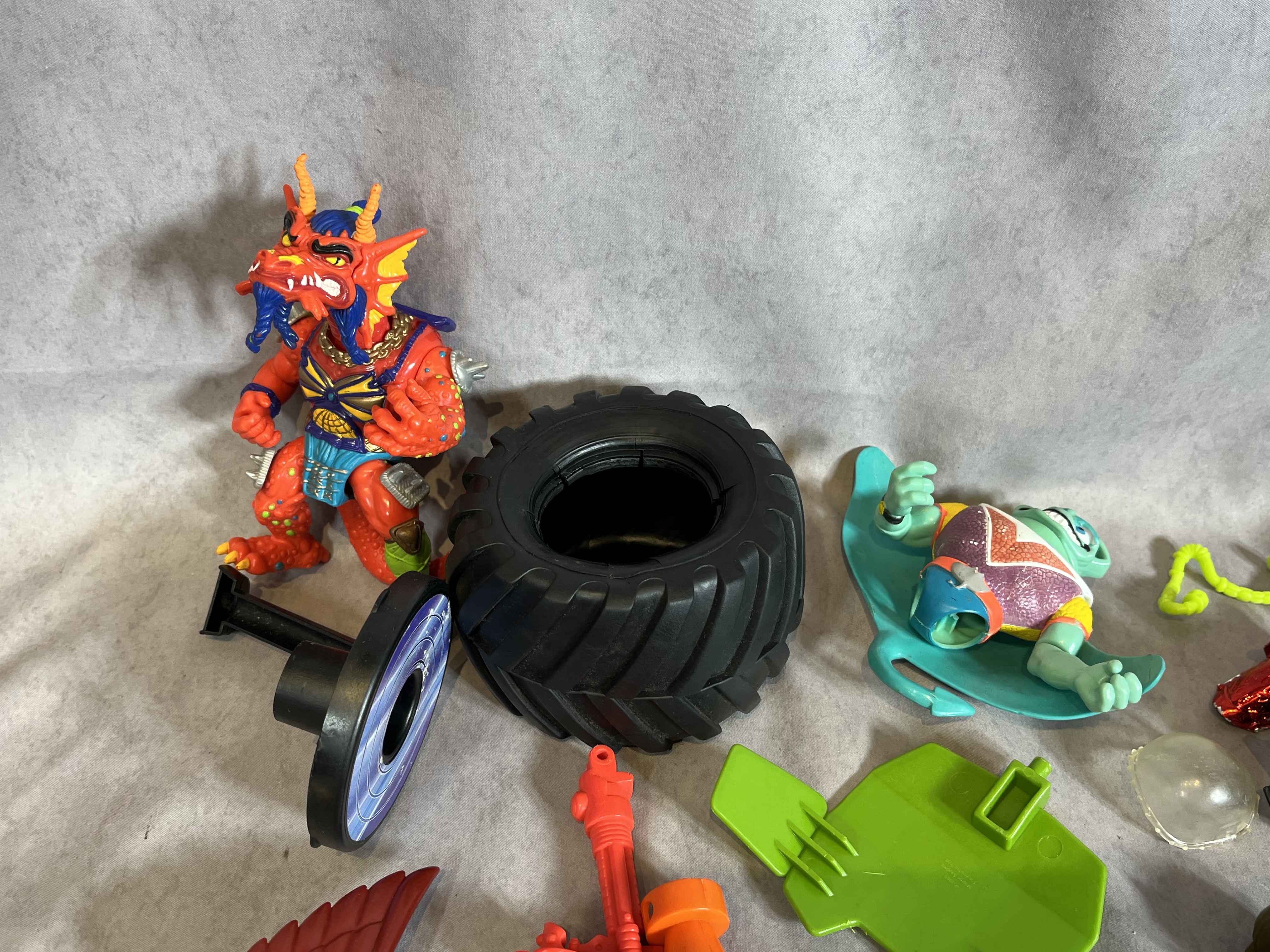 Assortment of Vintage Teenage Mutant Ninja Turtles Action Figures and Sewer Playset Components by Playmates Toys