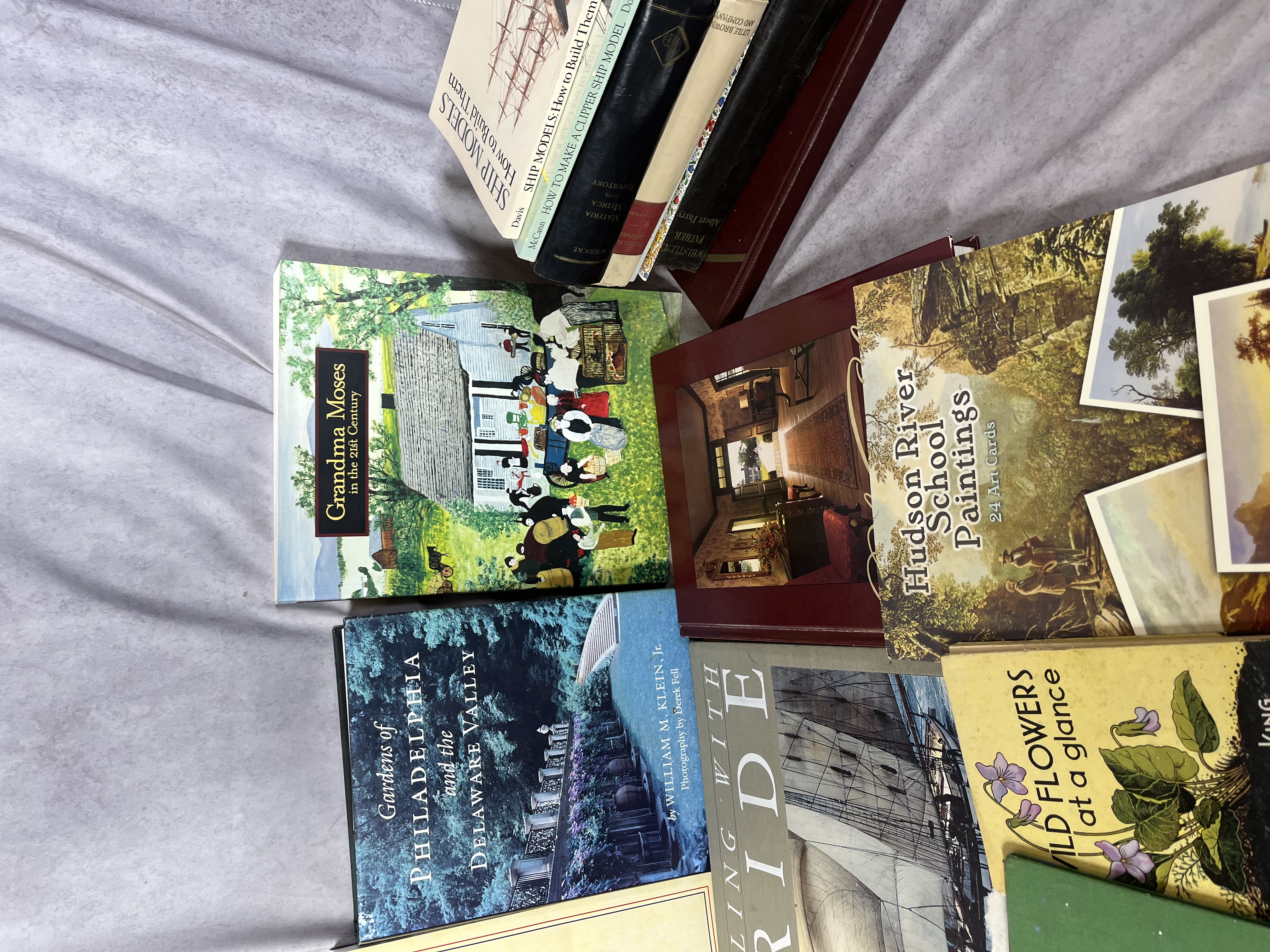 A Collection of Books and Ephemera including Art History, Maritime Modeling, and Collegiate Interests. (DJ)