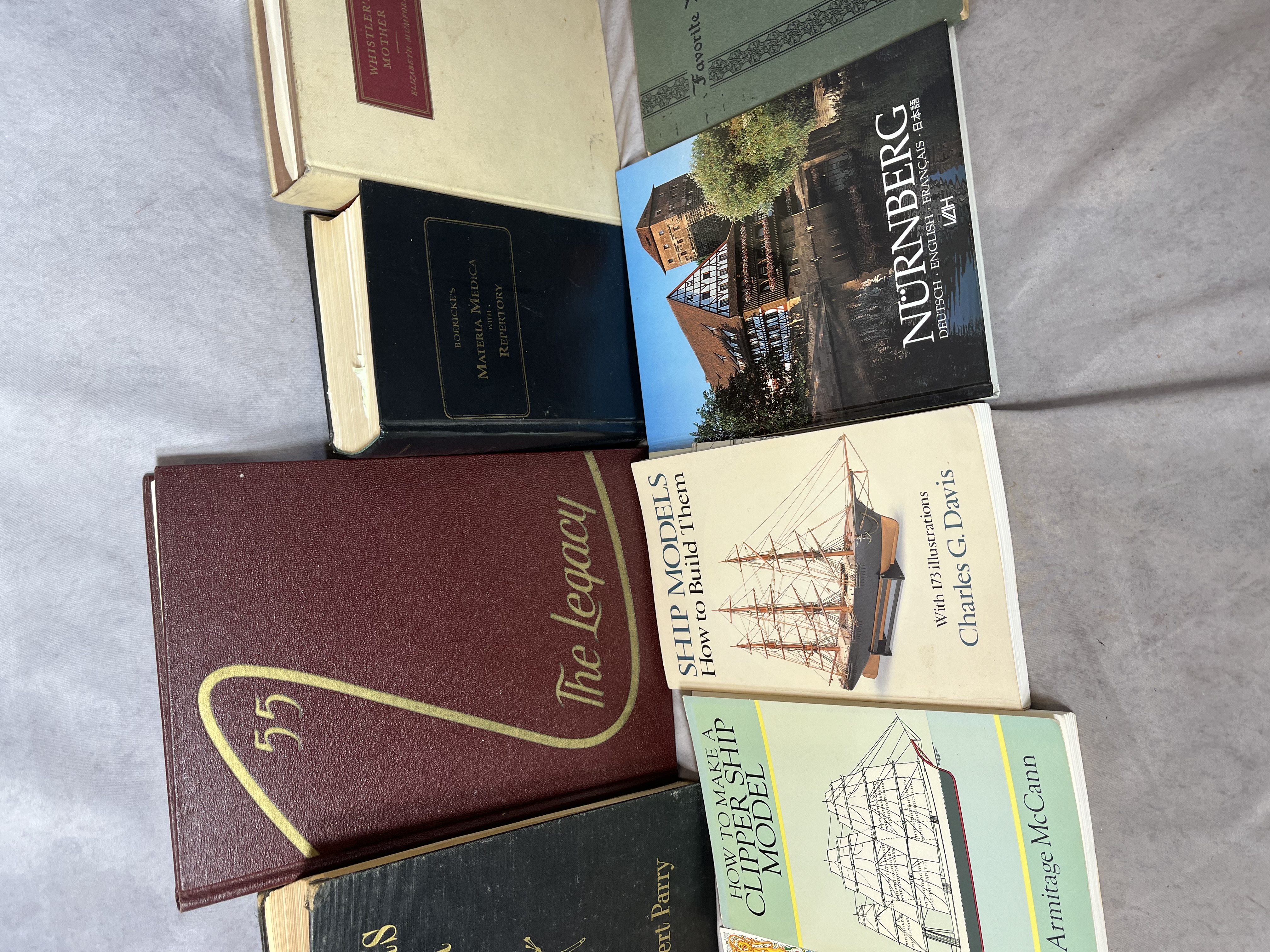 A Collection of Books and Ephemera including Art History, Maritime Modeling, and Collegiate Interests. (DJ)