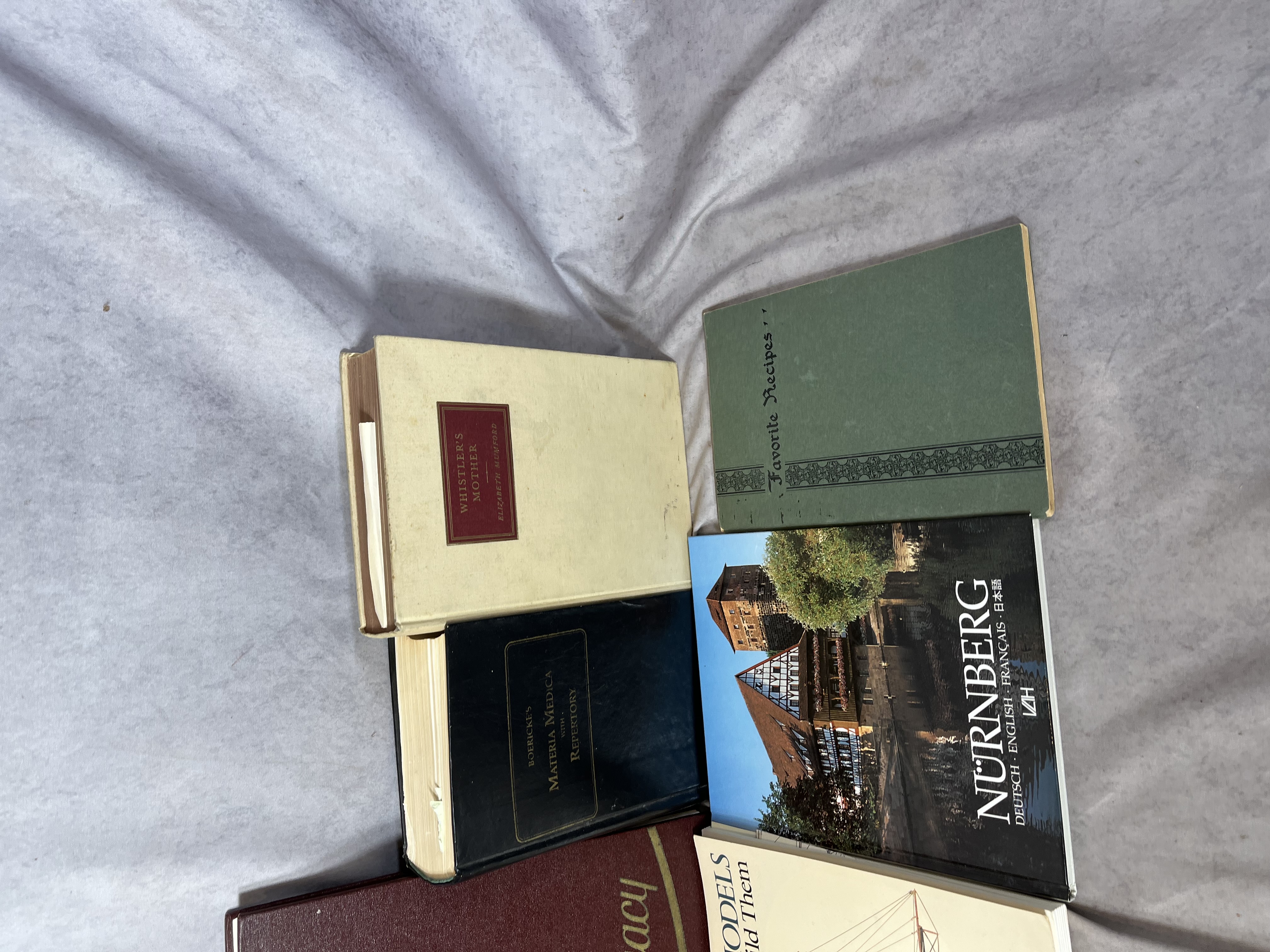 A Collection of Books and Ephemera including Art History, Maritime Modeling, and Collegiate Interests. (DJ)