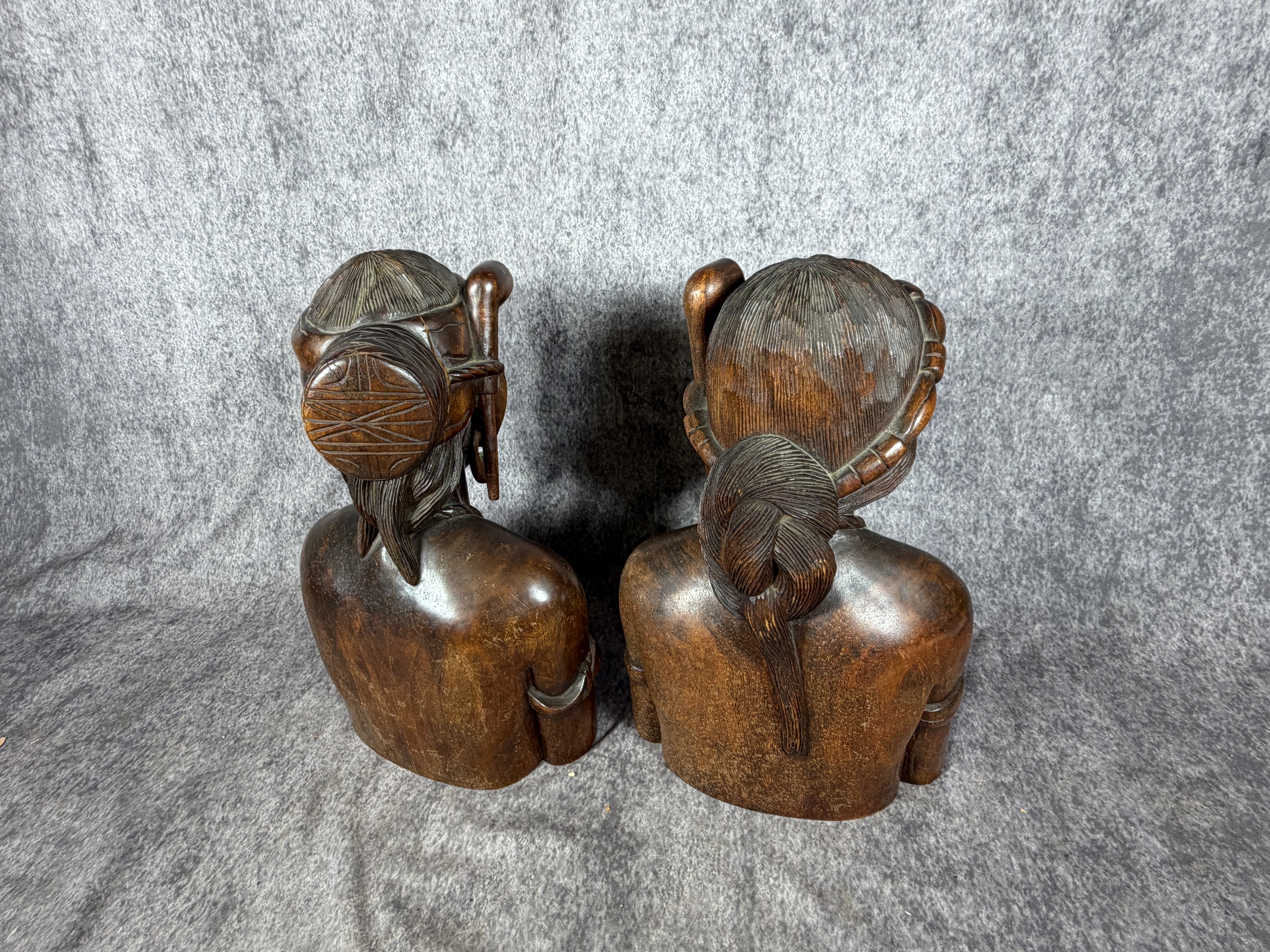 A Pair of Carved Hardwood Tribal Busts in the Style of Igorot Folk Art