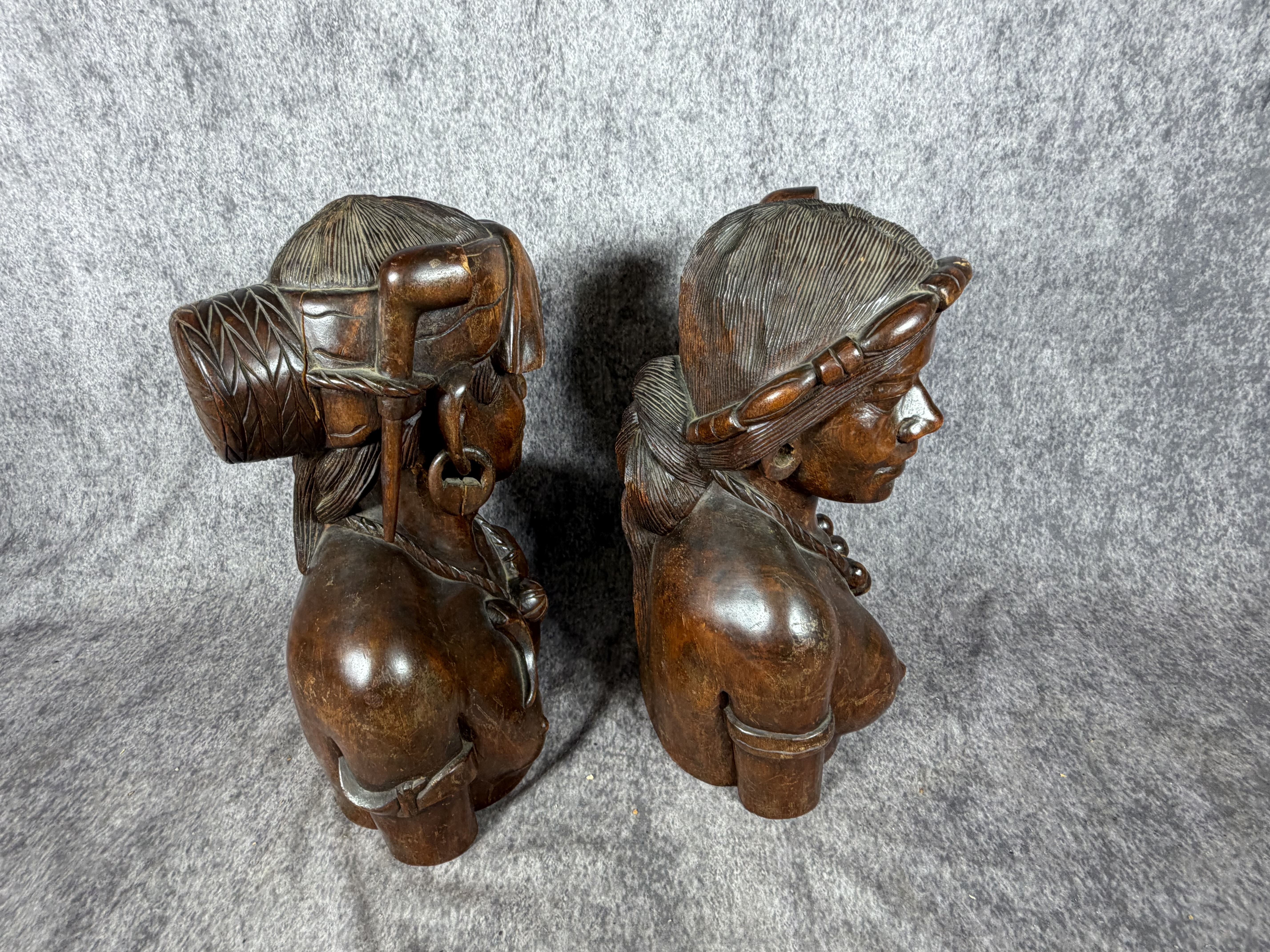 A Pair of Carved Hardwood Tribal Busts in the Style of Igorot Folk Art