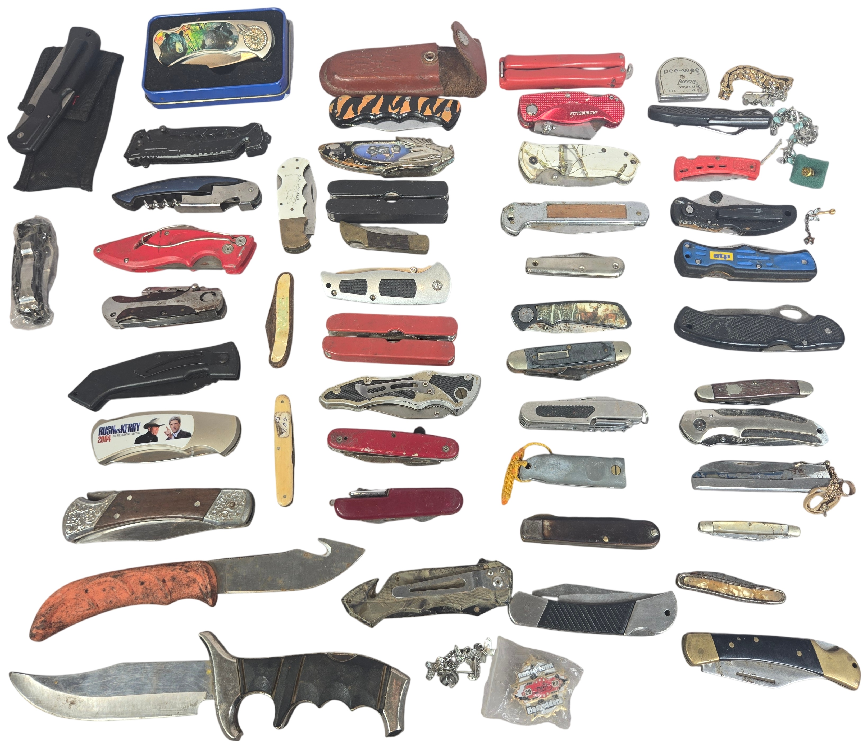 An Assortment of approximately 50 Vintage and Modern Pocket Knives, Multi-tools, and Small Collectibles