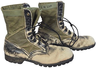 A Pair of Vietnam War Era Bata Jungle Boots. A pair of olive green canvas and distressed leather 
