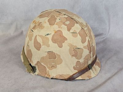 WWII USMC M1 Front Seam Swivel Bale Combat Helmet with Frogskin Camouflage Cover and Liner. This 