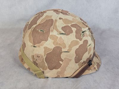 WWII to Korean War Era USMC M1 Steel Helmet with First Pattern Camouflage Cover and Liner. This 
