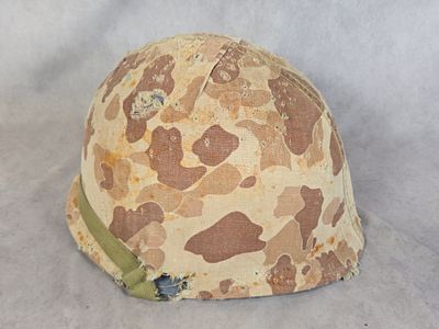 US M1 Combat Helmet with First Pattern USMC Reversible Camouflage Cover and Liner. This lot 