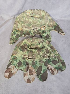 A Pair of WWII USMC Blue Ridge Overall Co. Inc. M1942 Camouflage Helmet Covers. This lot 