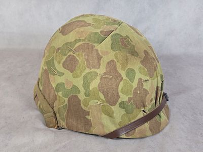 WWII US M1 Combat Helmet with USMC Frogskin Camouflage Cover and Liner. A United States World 