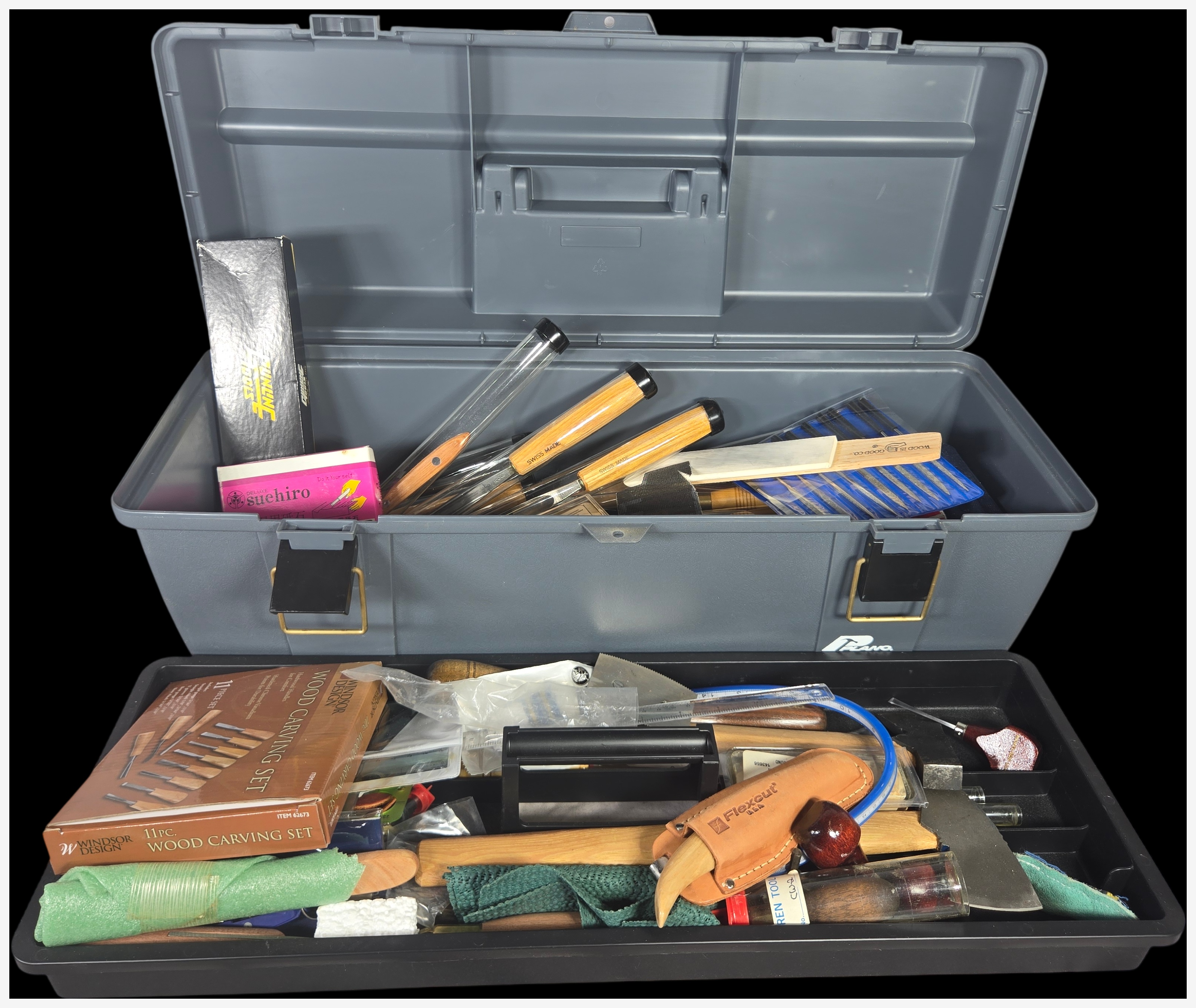 A Collection of Professional and Hobbyist Woodcarving and Woodworking Tools in a Plano Toolbox