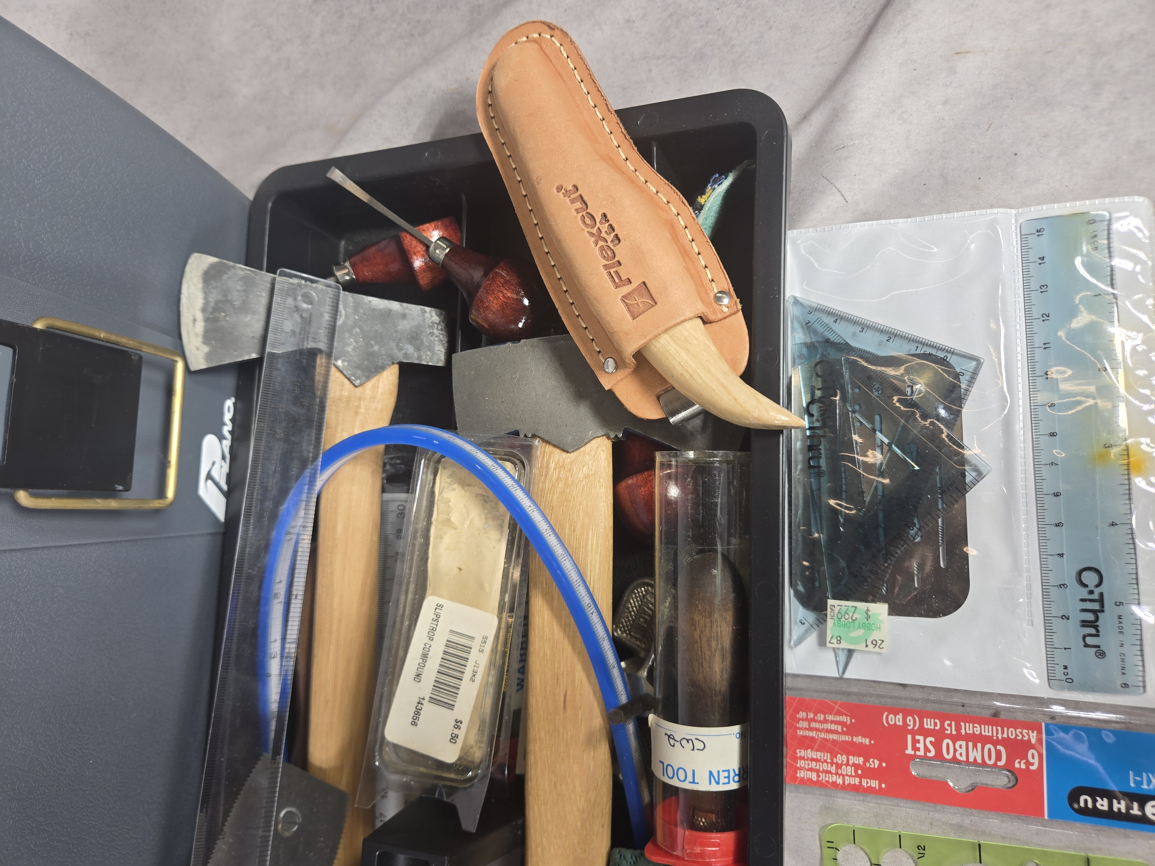 A Collection of Professional and Hobbyist Woodcarving and Woodworking Tools in a Plano Toolbox