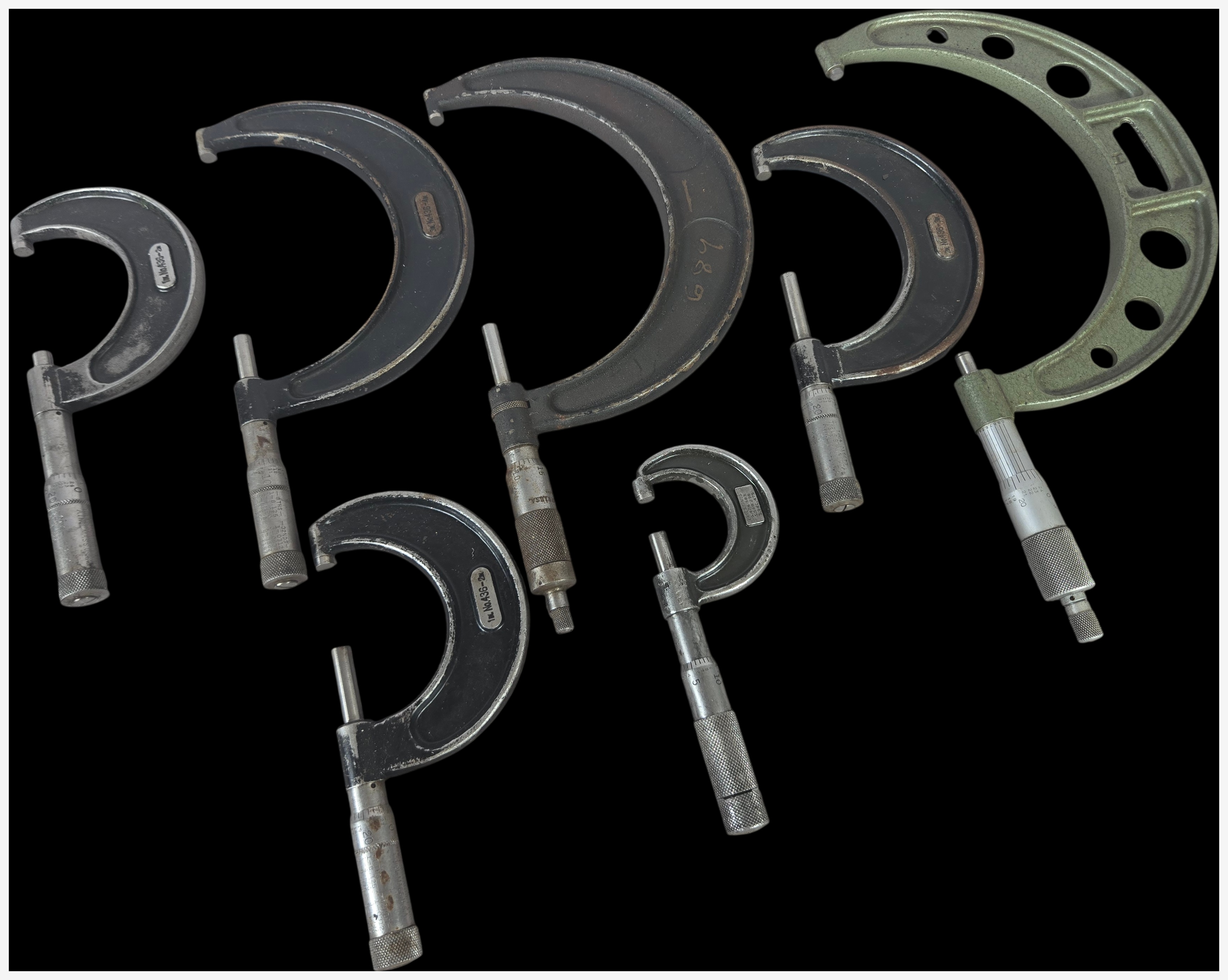 A Collection of Seven Vintage Outside Micrometer Calipers by Starrett, Lufkin, and Brown and Sharpe