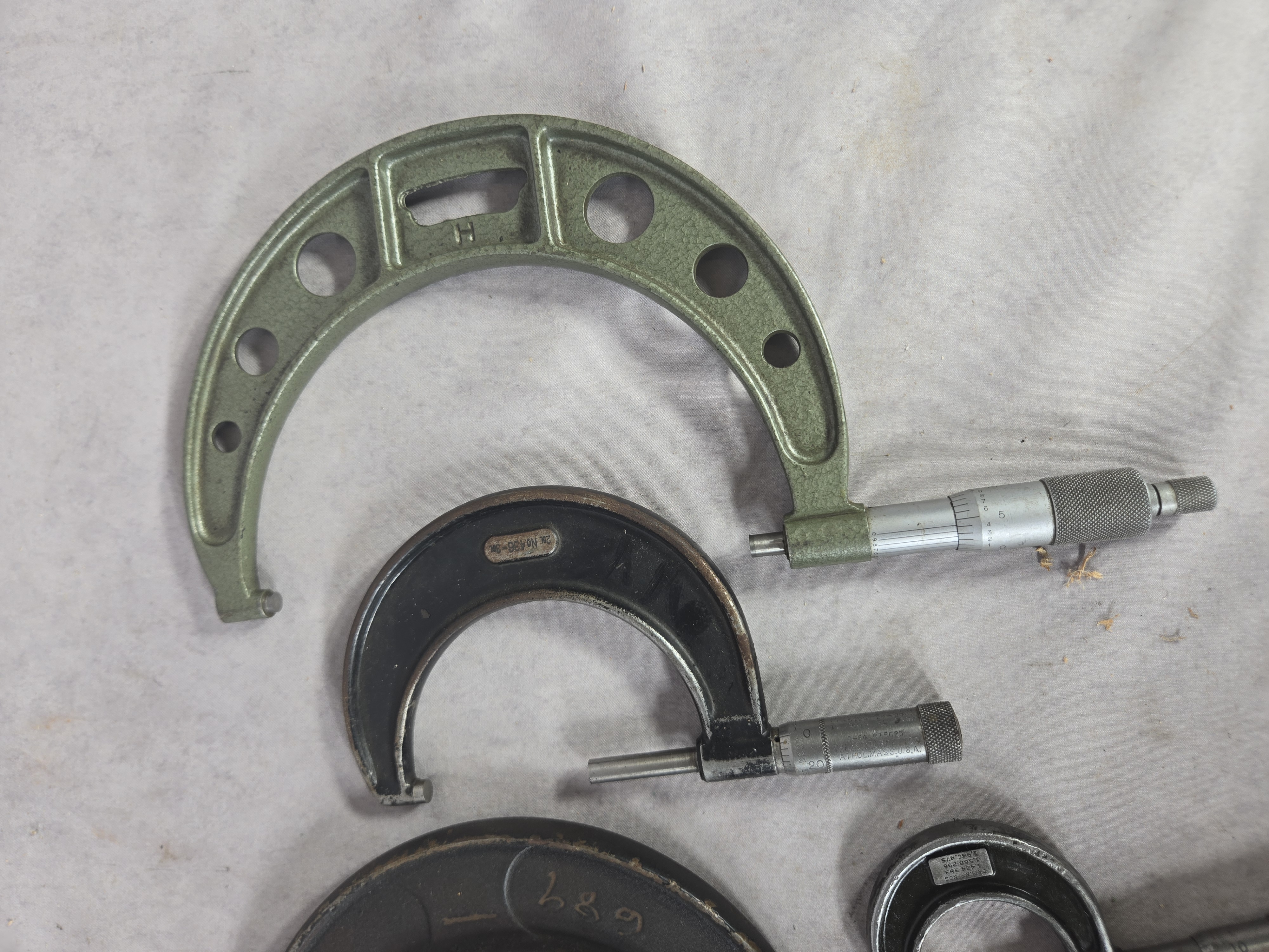 A Collection of Seven Vintage Outside Micrometer Calipers by Starrett, Lufkin, and Brown and Sharpe
