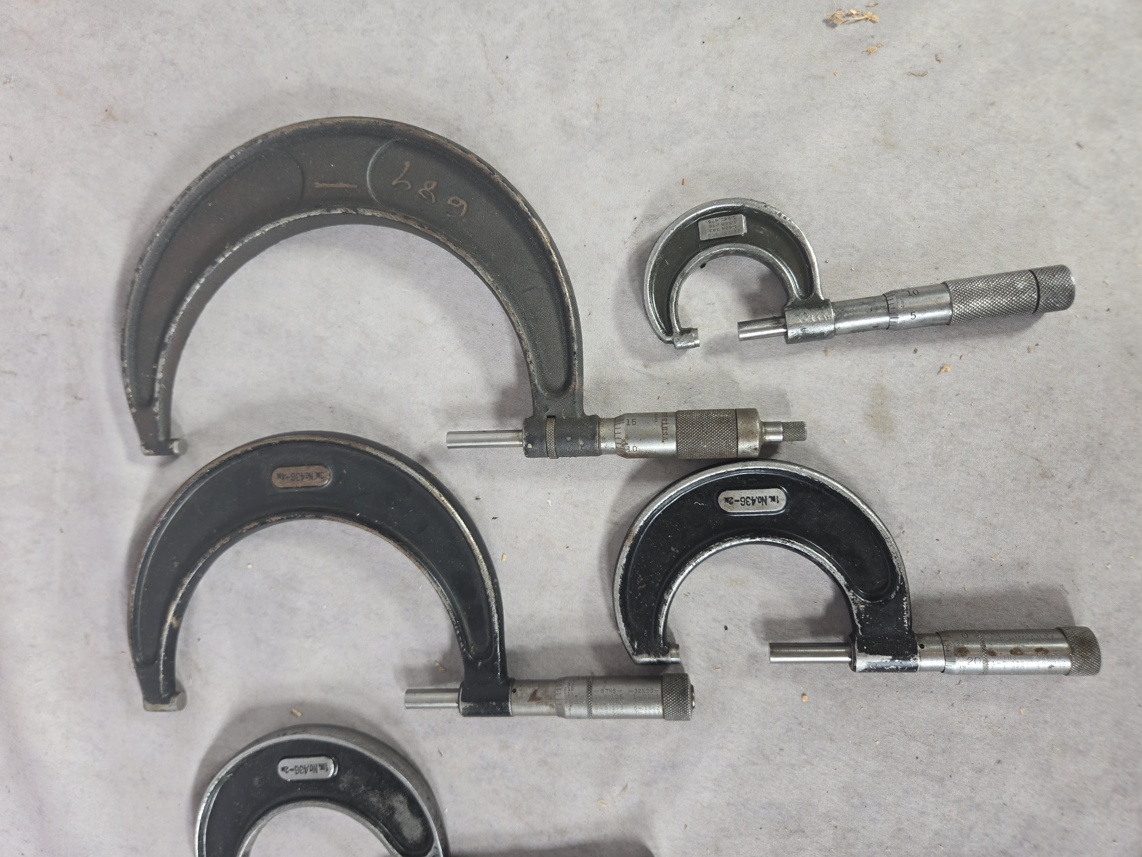A Collection of Seven Vintage Outside Micrometer Calipers by Starrett, Lufkin, and Brown and Sharpe