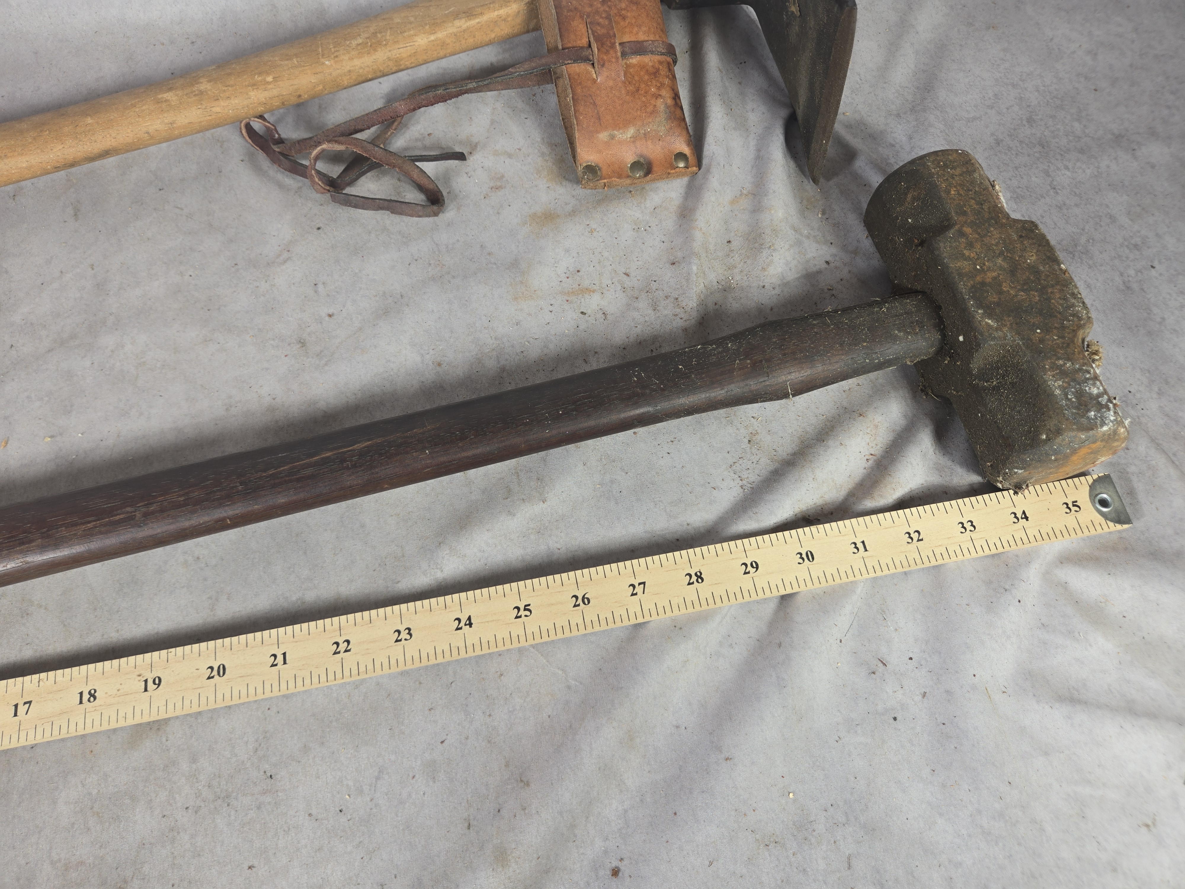 Sledgehammer and a Carpenter's Adze with Leather Sheath