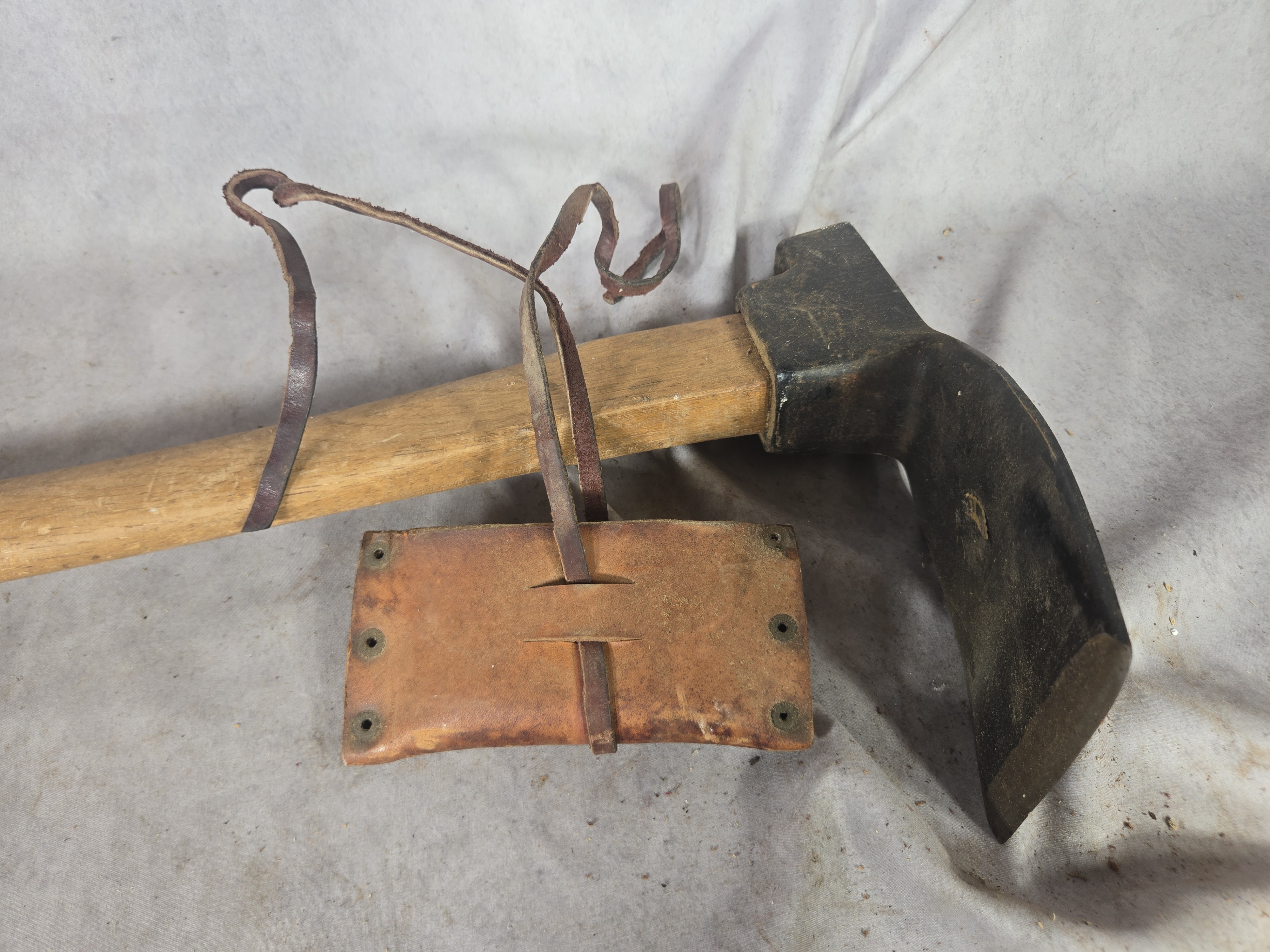 Sledgehammer and a Carpenter's Adze with Leather Sheath