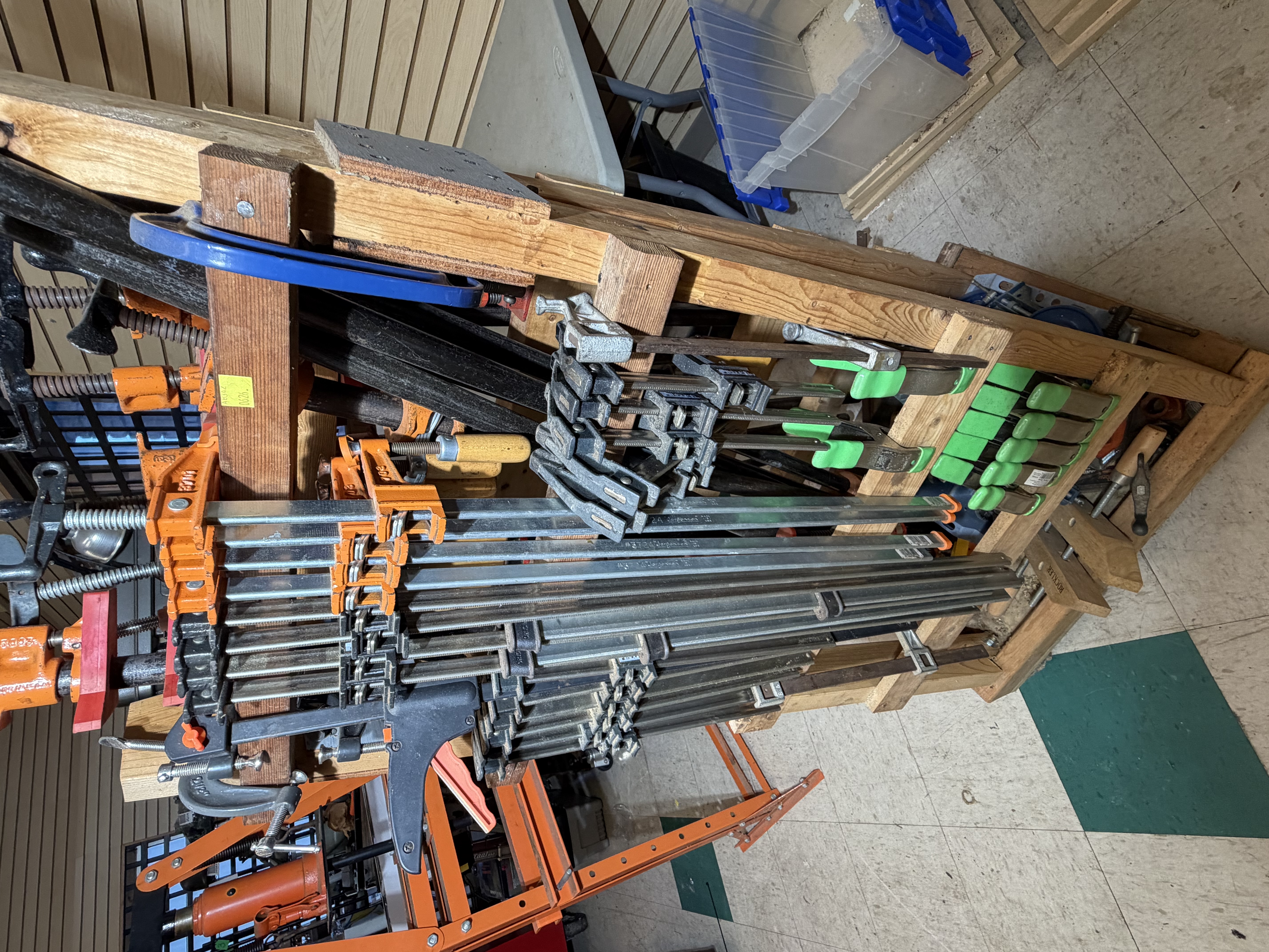A Collection of Woodworking Clamps and a Mobile Storage Rack
